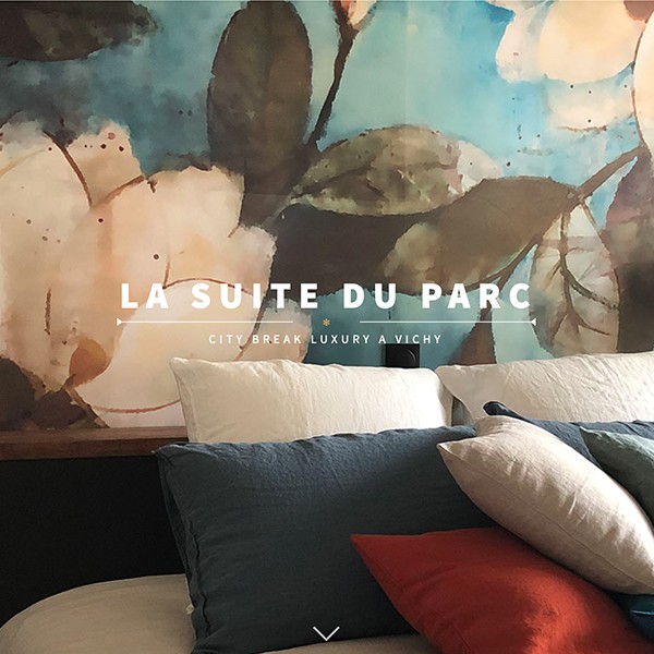 Hotel page screenshot with bed and wall mural