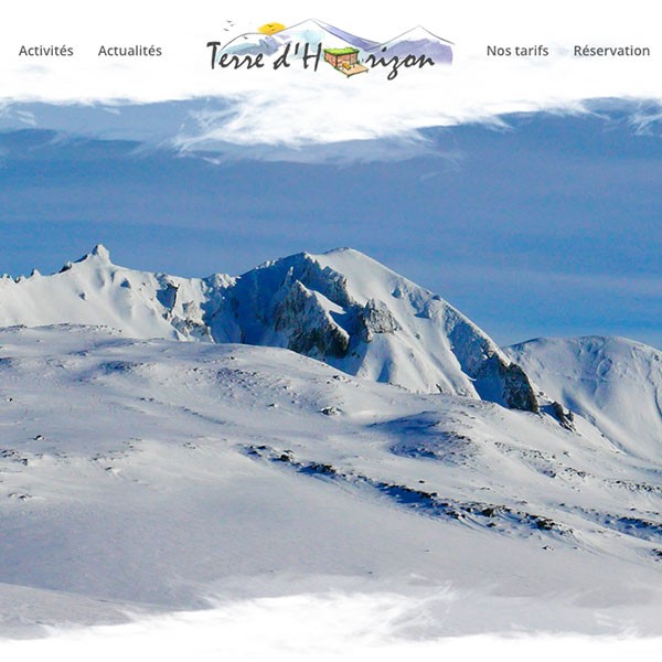 Screenshot of a website with snowy mountain landscape