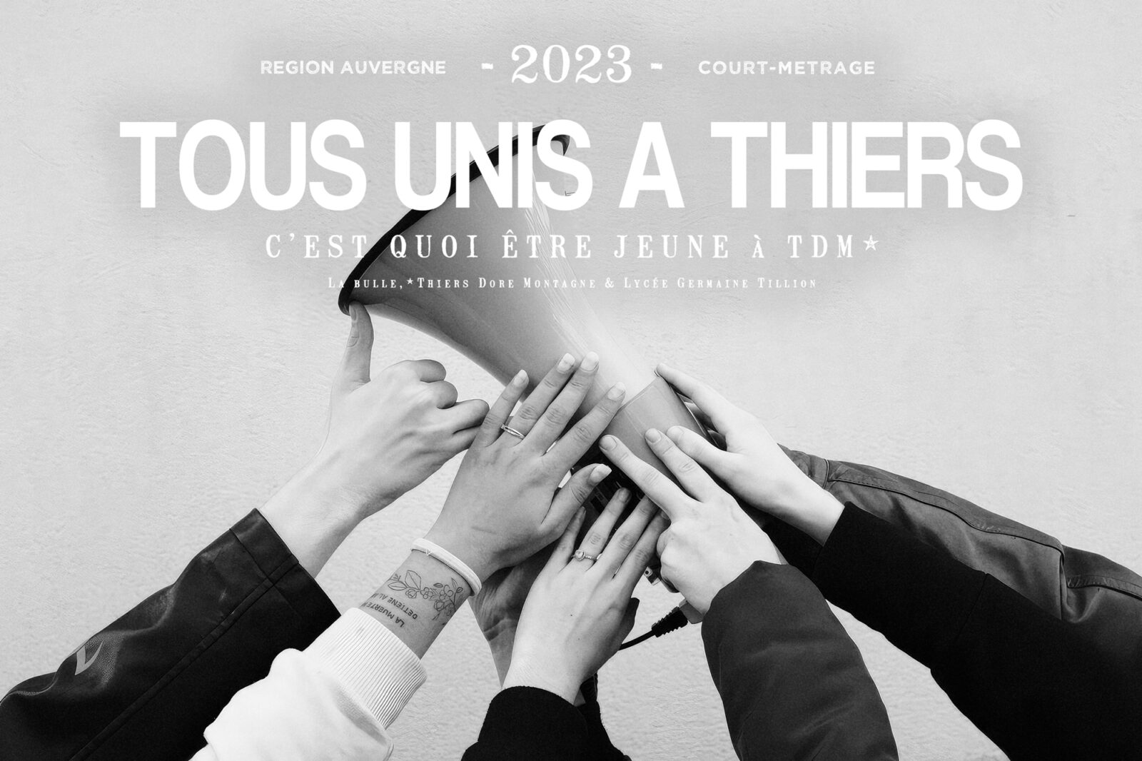 Black and white poster for a communications agency Raised hands beneath the title « All united in Thiers »