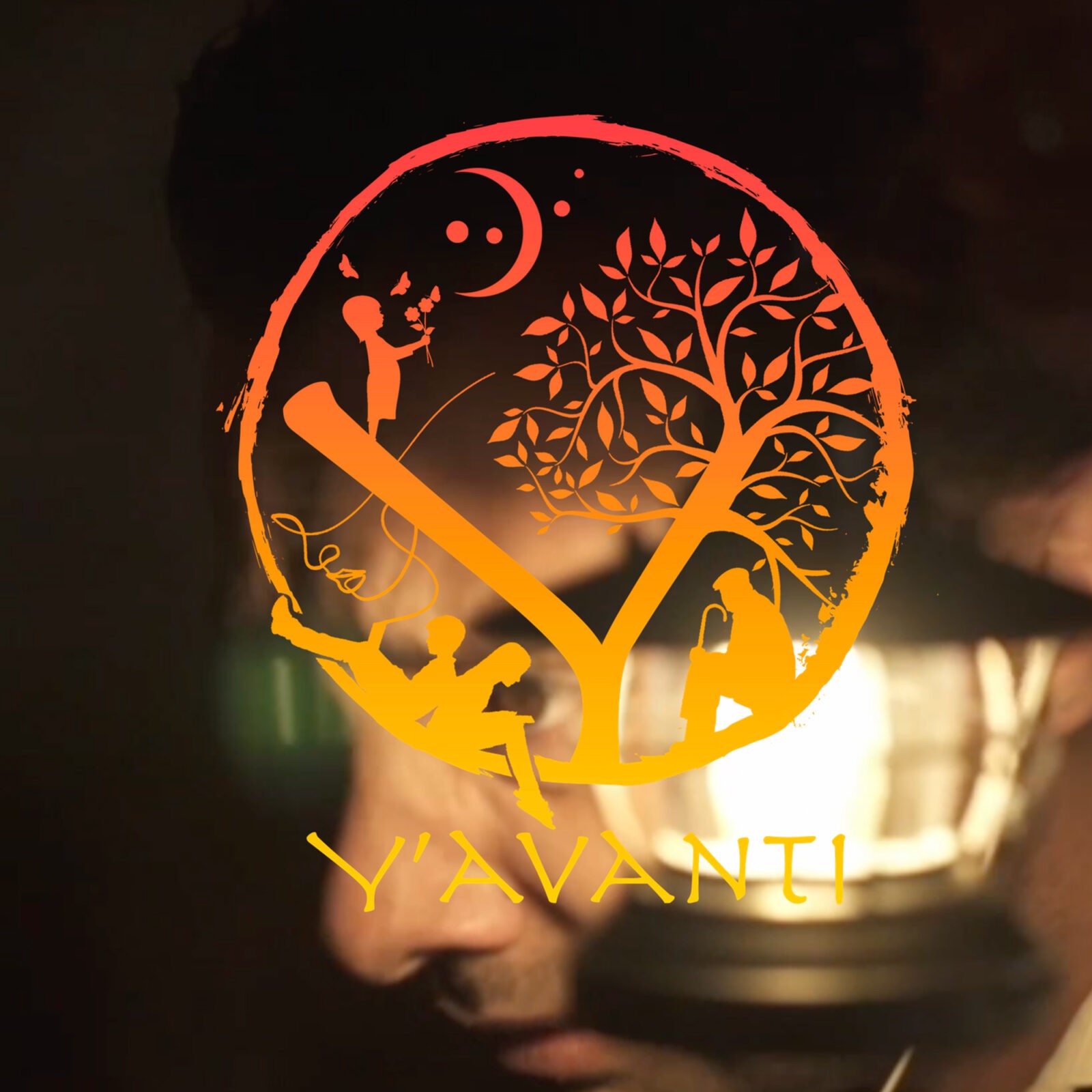 Orange Y’Avanti logo overlaid on a dark scene
